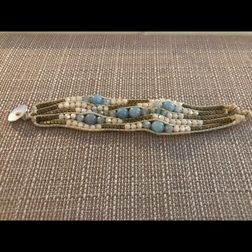 Blue and gold and cream fair trade bracelets handmade by artisans in Thailand.